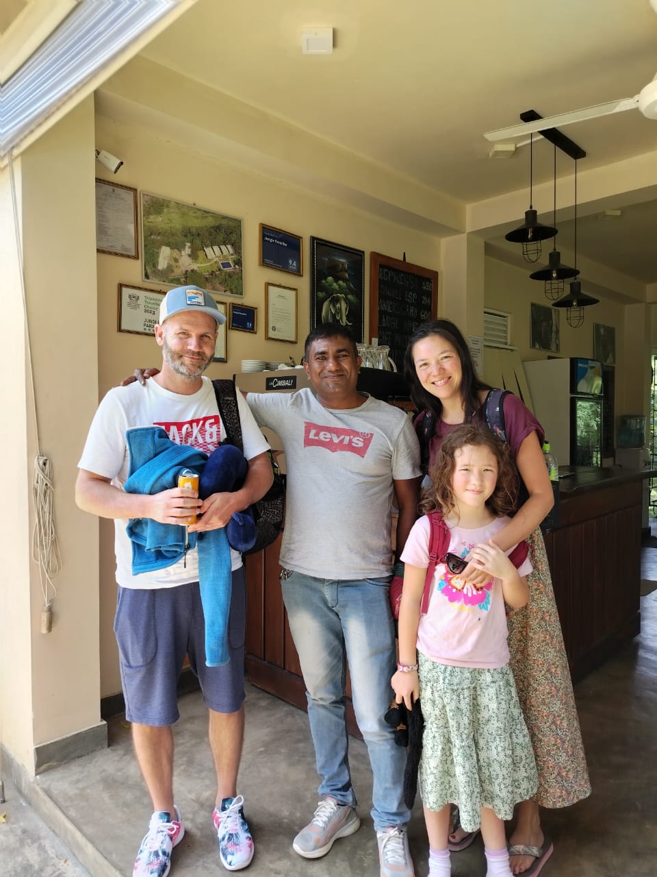 Happy tourists with Taxi Tissamaharama driver during a private tour in southern Sri Lanka